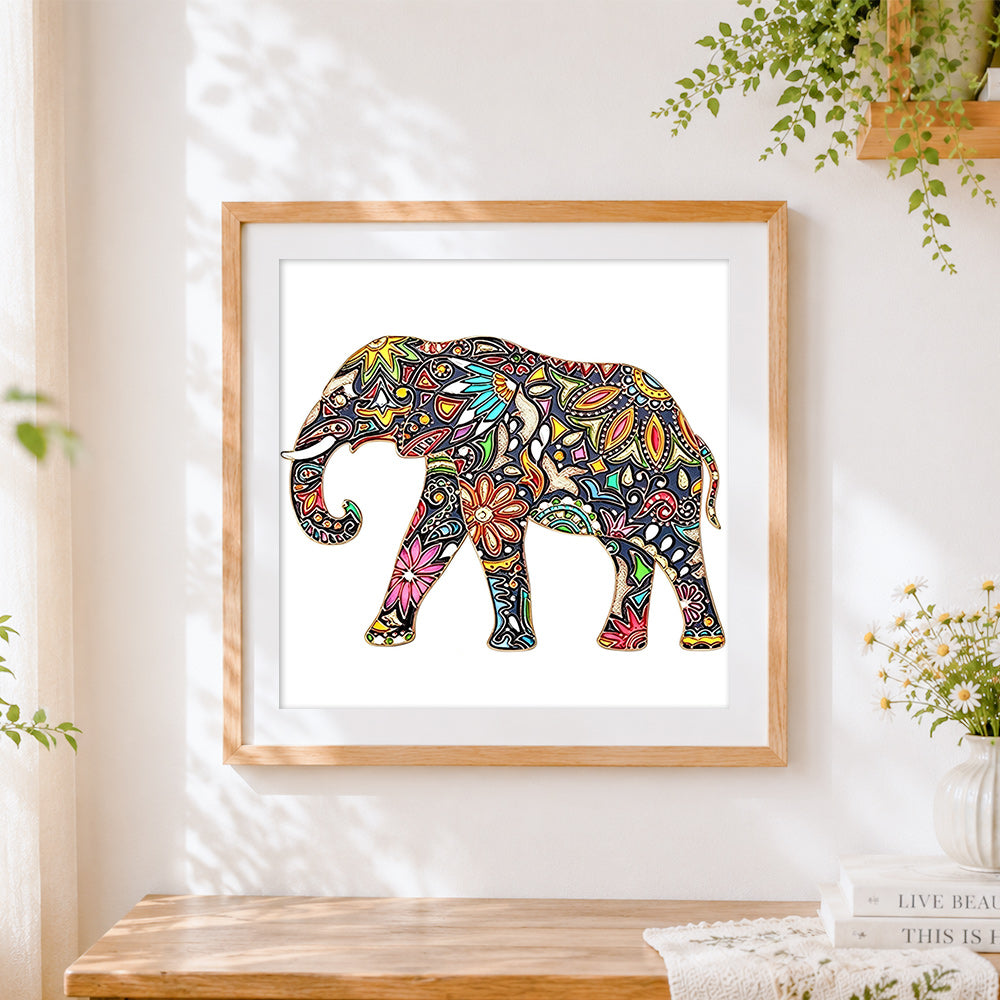 Finished ornate floral elephant cross stitch artwork displayed