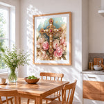 Ornate gold cross with pink roses cross stitch artwork displayed on wall as home decor