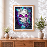 Finished ornate white skull with purple eyes cross stitch artwork displayed