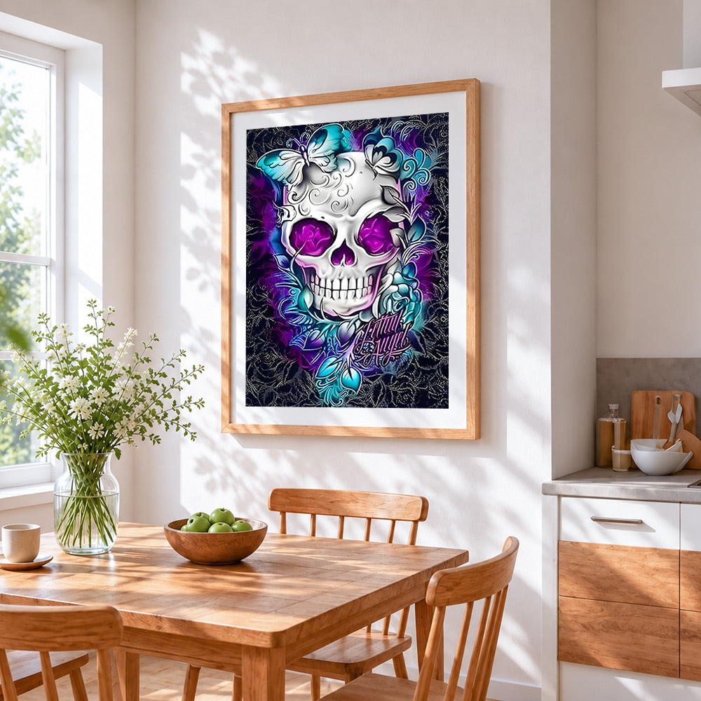 Ornate white skull with purple eyes cross stitch artwork displayed on wall as home decor