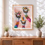 Finished ostriches with flower crowns cross stitch artwork displayed