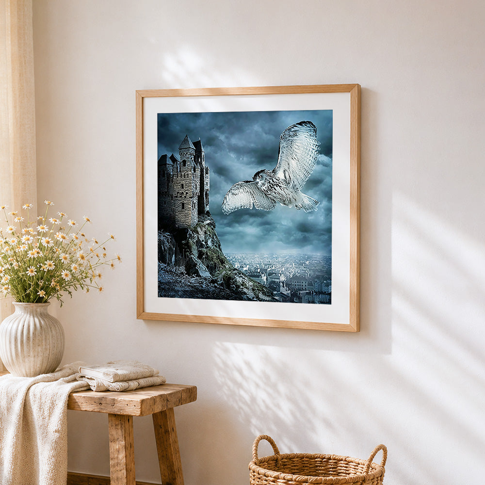Owl flying over gothic castle cross stitch artwork displayed on wall as home decor