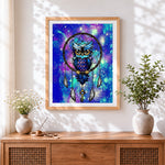 Finished owl in a fantasy dreamcatcher cross stitch artwork displayed