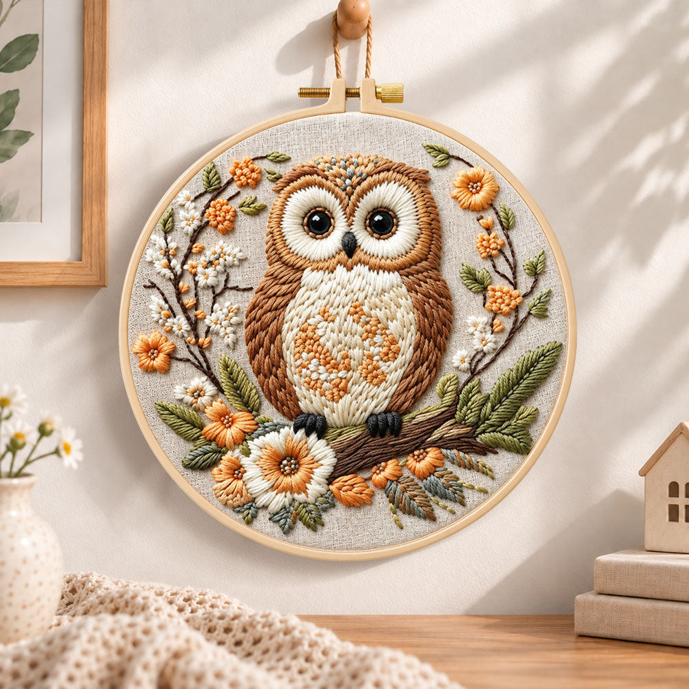 Owl on blossom branch embroidery hoop wall art displayed as warm and cosy handmade home decor
