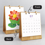 Front and back view of the Floral Blooms desk calendar showing the monthly dates and finished lotus painting