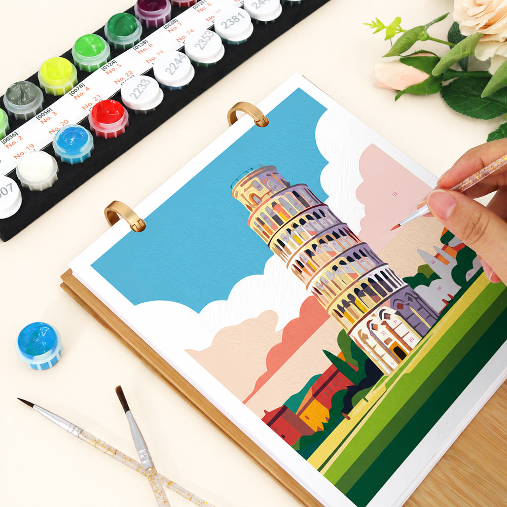 Close-up of painting the Leaning Tower of Pisa illustration on the Iconic Landmarks desk calendar