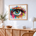 Paint splash colourful eye cross stitch artwork displayed on wall as home decor