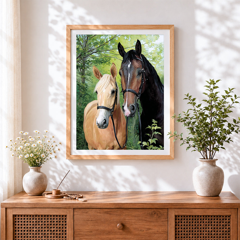 Finished pair of horses portrait cross stitch artwork displayed