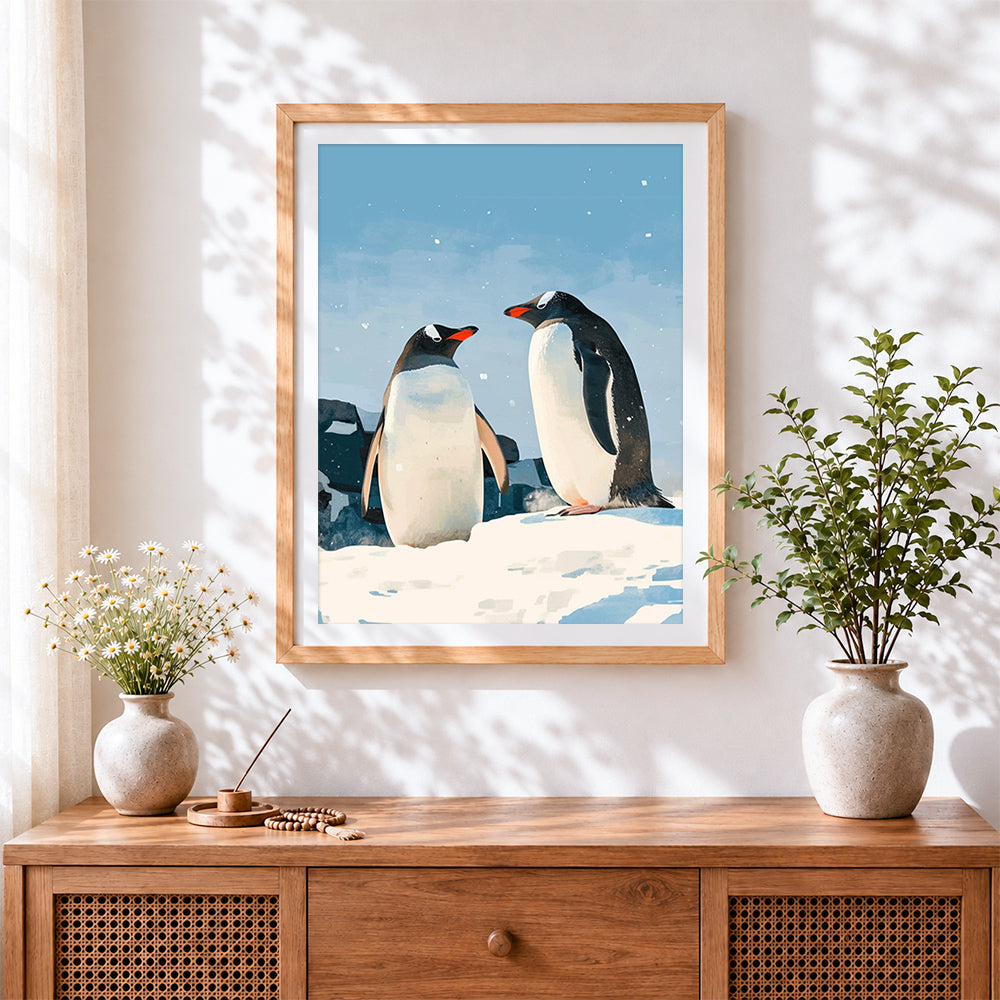 Finished pair of penguins in the snow cross stitch artwork displayed