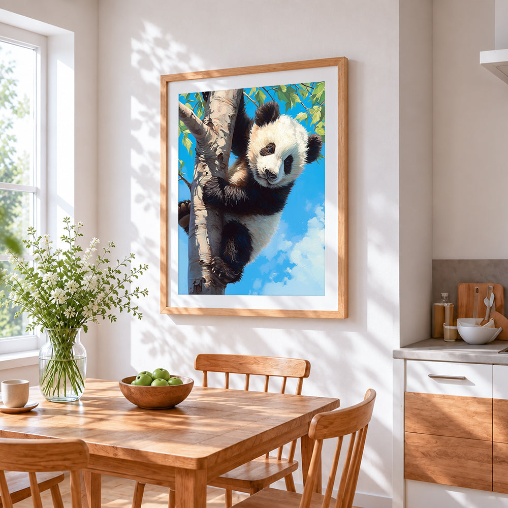Panda cub climbing a tree cross stitch artwork displayed on wall as home decor