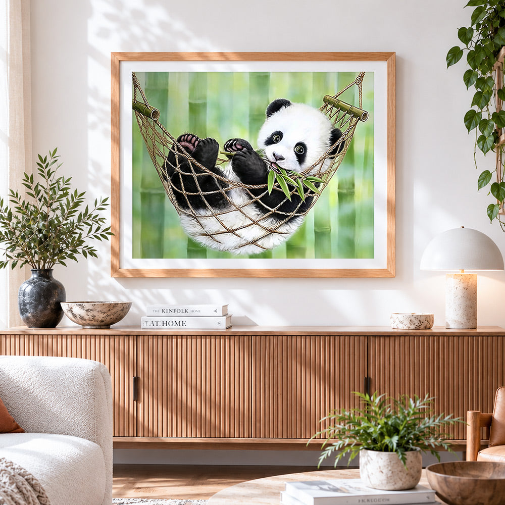 Finished panda cub in a hammock paint by numbers artwork displayed as home decor