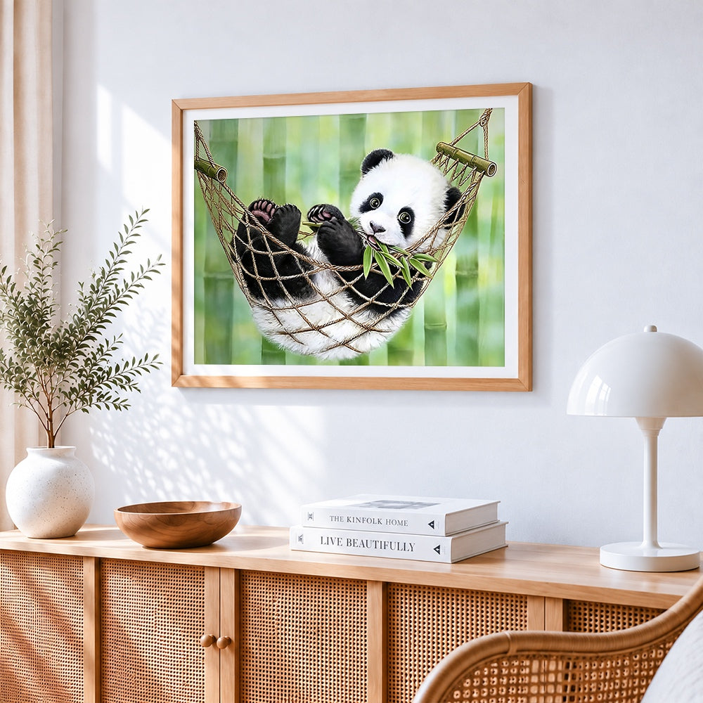 Panda cub in a hammock paint by numbers artwork displayed on wall as home decor