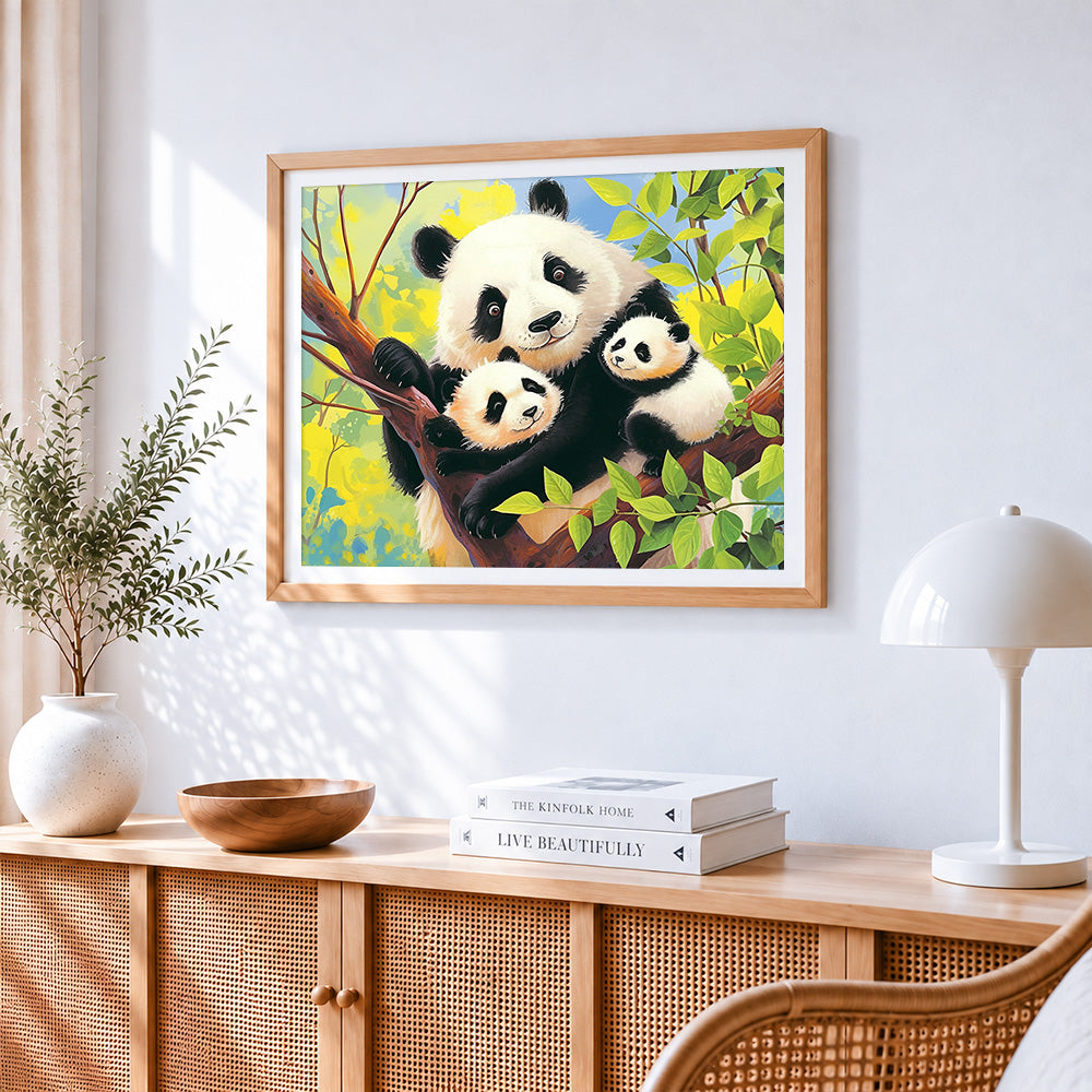Panda family in a tree cross stitch artwork displayed on wall as home decor