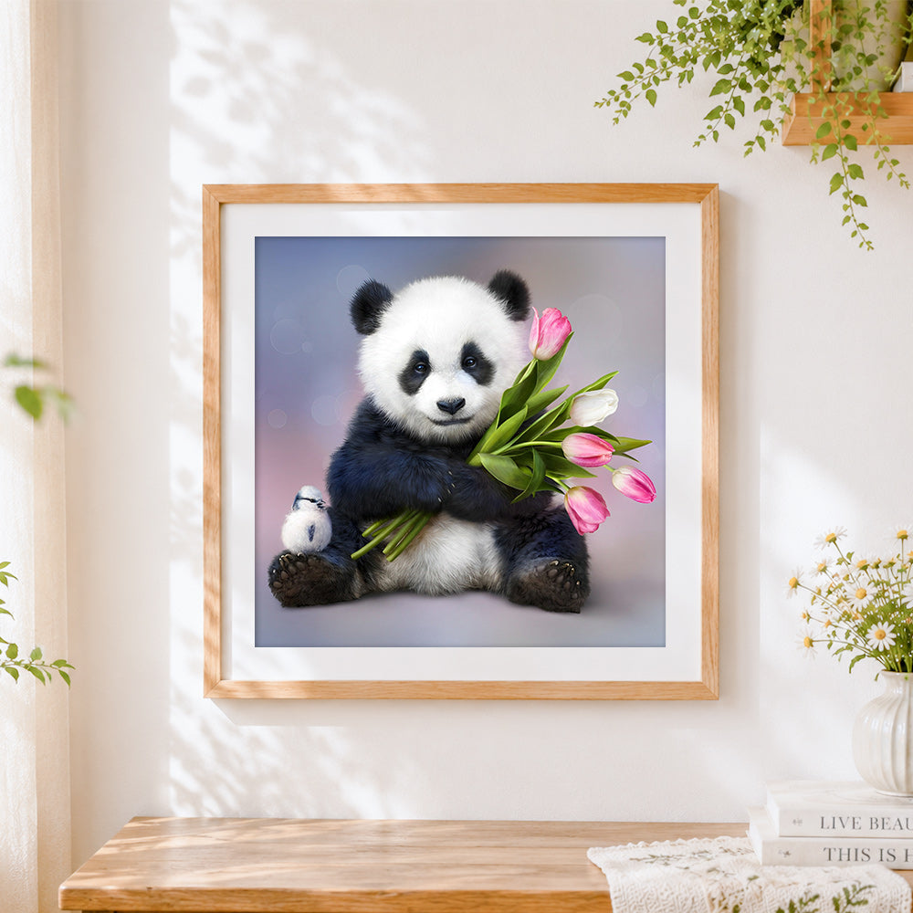 Finished panda hugging pink tulips cross stitch artwork displayed