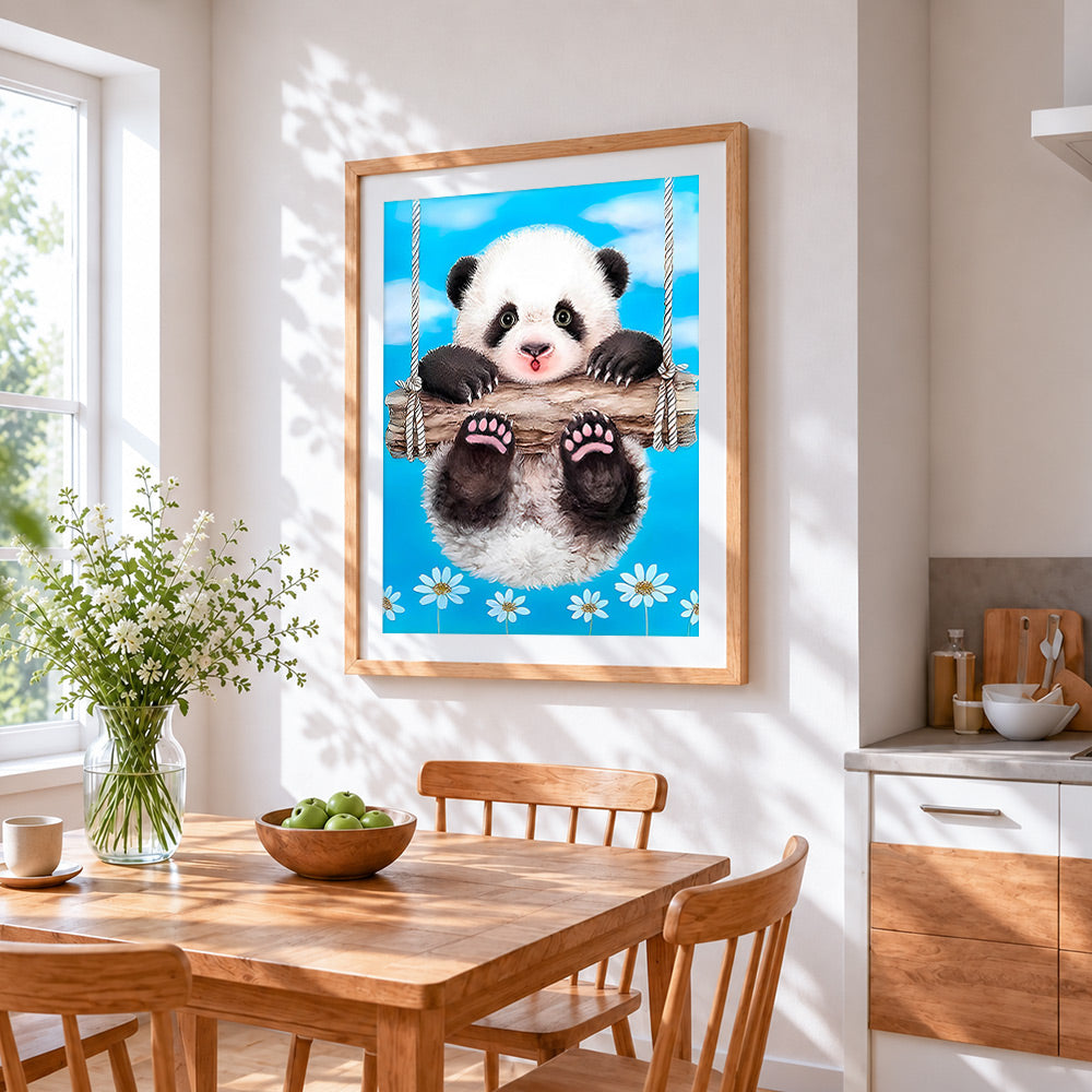 Panda on swing cross stitch artwork displayed on wall as home decor