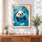 Finished panda swimming with koi fish cross stitch artwork displayed