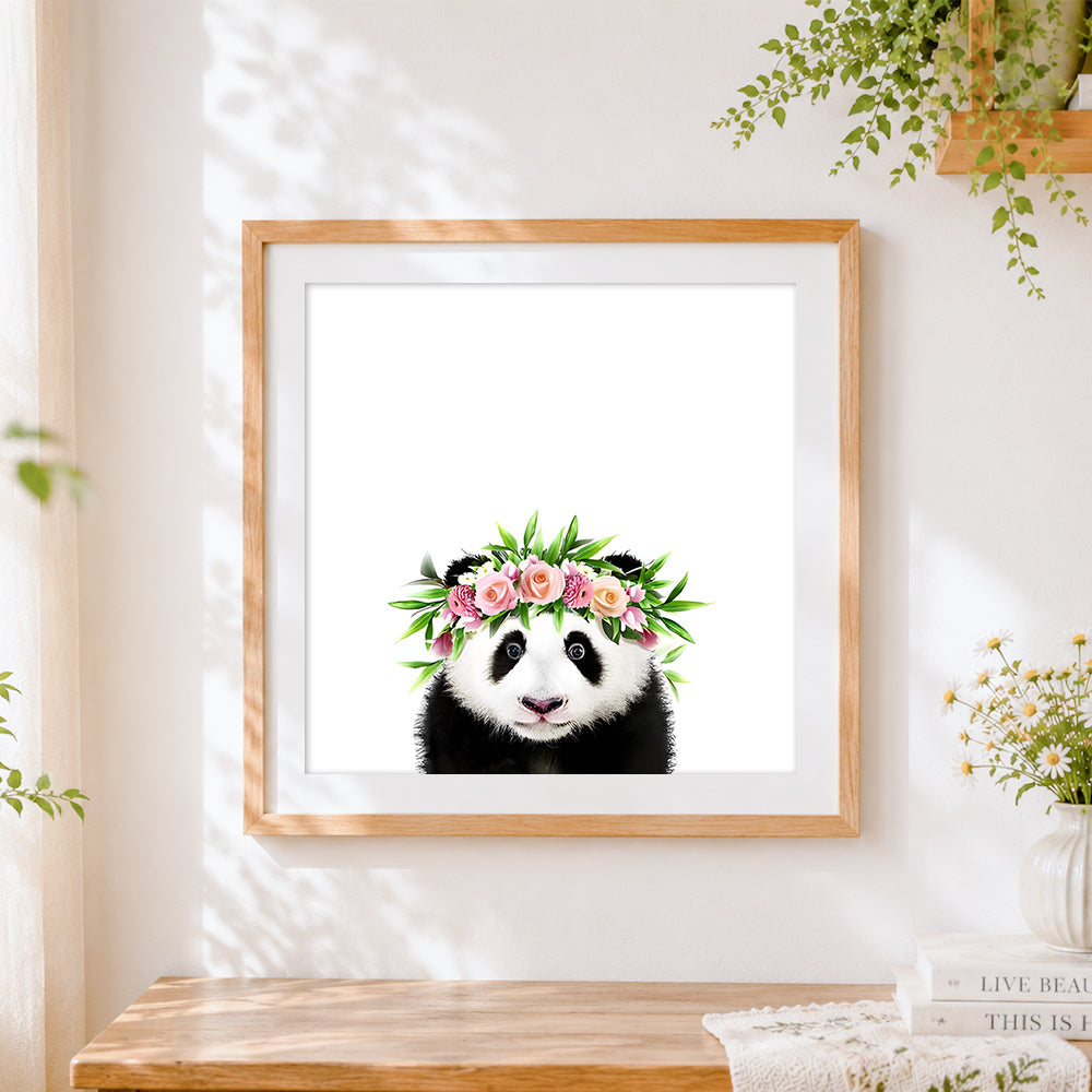 Finished panda with floral crown cross stitch artwork displayed