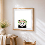 Panda with floral crown cross stitch artwork displayed on wall as home decor