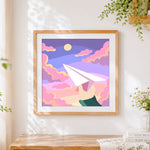 Finished paper aeroplane dreams cross stitch artwork displayed