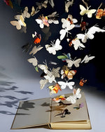 Paper butterflies flying from a book cross stitch kit for beginners