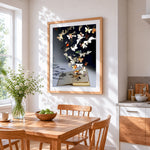 Paper butterflies flying from a book cross stitch artwork displayed on wall as home decor