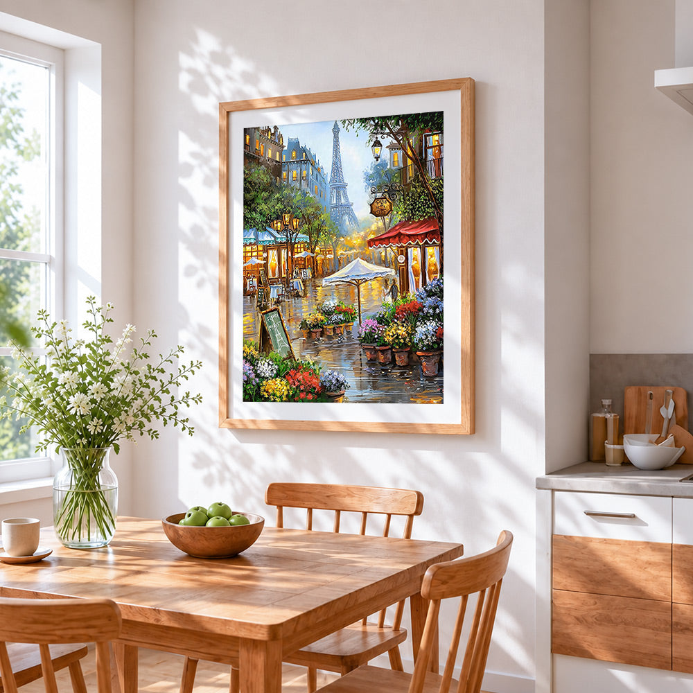 Parisian street cafe cross stitch artwork displayed on wall as home decor