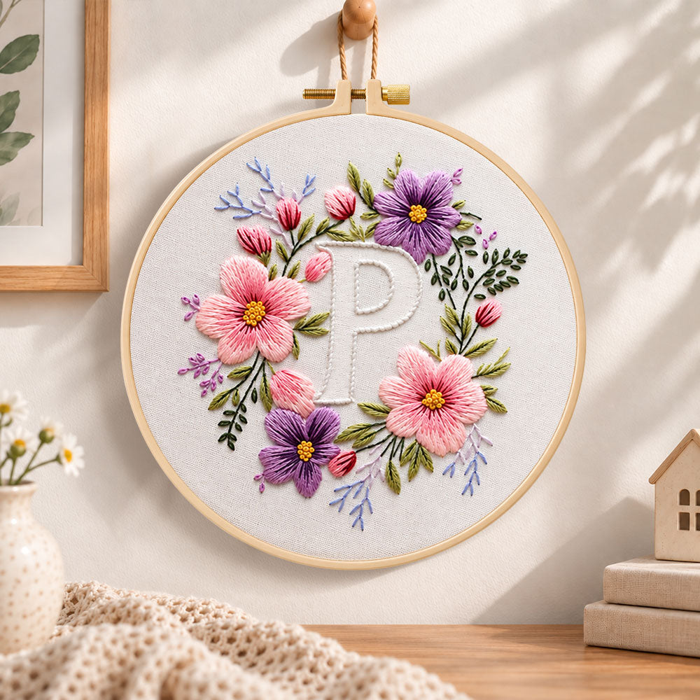 Pastel blossoms and letter p embroidery hoop wall art displayed as warm and cosy handmade home decor