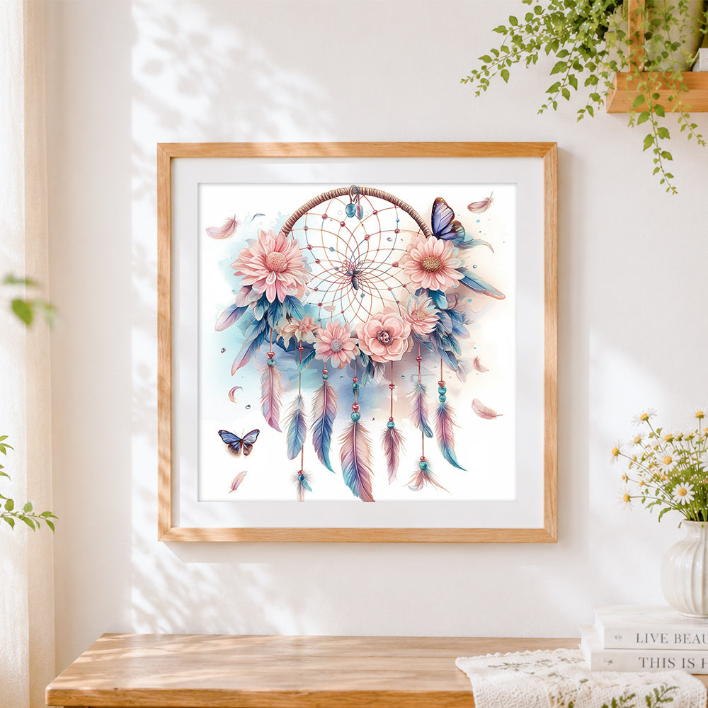 Finished pastel daisy and feather dreamcatcher cross stitch artwork displayed