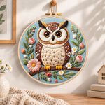 Pastel floral owl embroidery hoop wall art displayed as warm and cosy handmade home decor