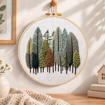 Pastel forest grove embroidery hoop wall art displayed as warm and cosy handmade home decor