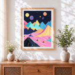 Finished pastel geometric mountains and planets cross stitch artwork displayed