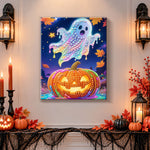 Finished pastel glowing ghost over jack‑o‑lantern pearl diamond painting artwork displayed as holiday home decor