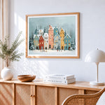 Pastel snowy houses paint by numbers artwork displayed on wall as home decor