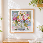 Finished pastel textured flowers cross stitch artwork displayed