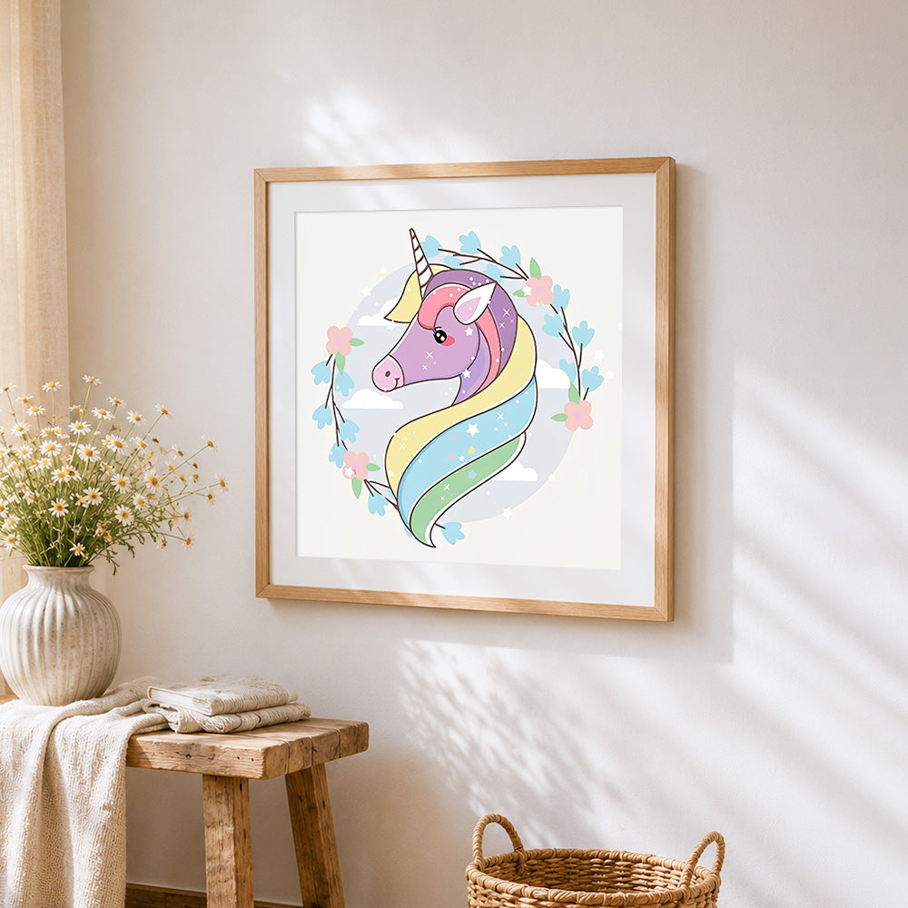 Pastel unicorn portrait with floral wreath cross stitch artwork displayed on wall as home decor