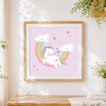 Finished pastel unicorn with rainbow and clouds cross stitch artwork displayed