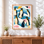 Finished pattern of penguins in abstract landscape cross stitch artwork displayed