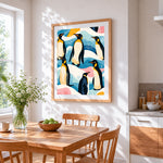Pattern of penguins in abstract landscape cross stitch artwork displayed on wall as home decor