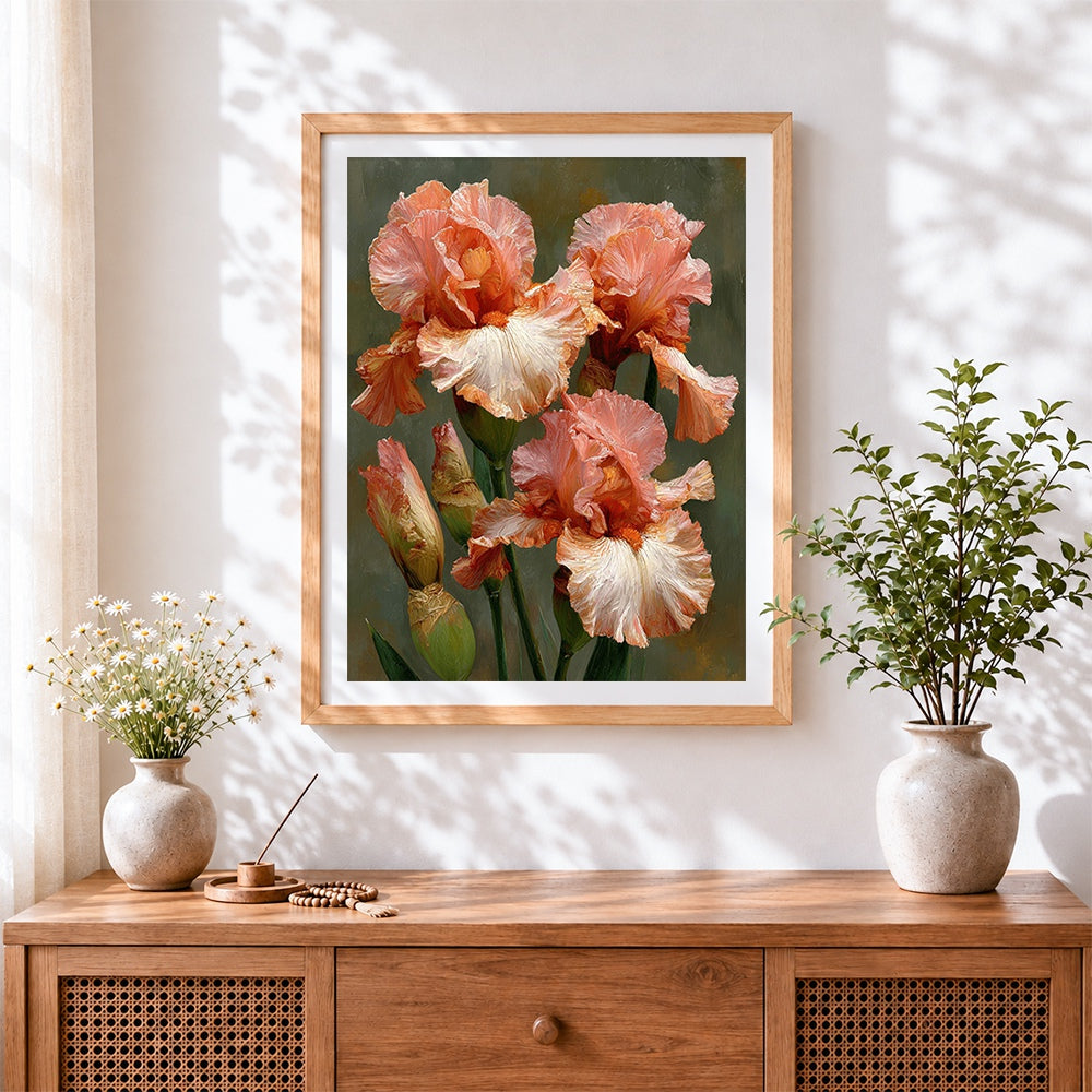 Finished peach and pink irises cross stitch artwork displayed