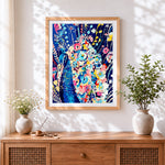 Finished peacock surrounded by colourful flowers cross stitch artwork displayed