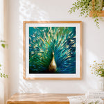Finished peacock with golden feathers cross stitch artwork displayed