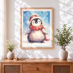 Finished penguin in santa hat and scarf cross stitch artwork displayed