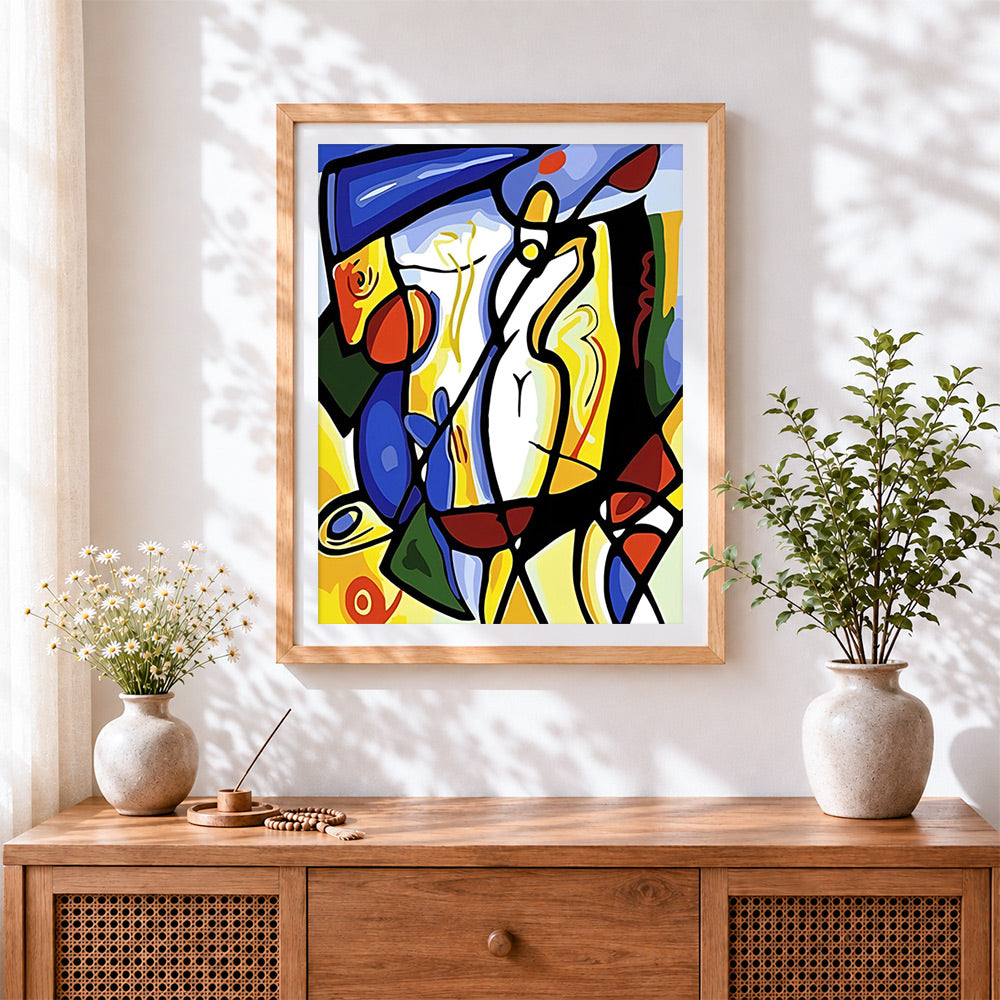 Finished picasso style abstract figure cross stitch artwork displayed