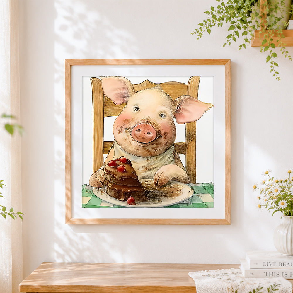 Finished pig eating chocolate cake cross stitch artwork displayed