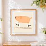 Finished pig on roller skates cross stitch artwork displayed