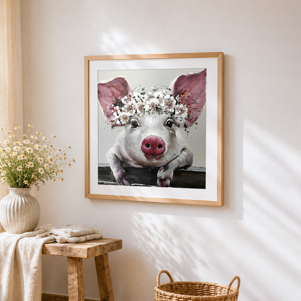 Pig with white floral crown cross stitch artwork displayed on wall as home decor
