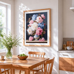 Pink and blue peonies in a chinoiserie vase cross stitch artwork displayed on wall as home decor