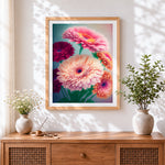 Finished pink and red gerbera daisies cross stitch artwork displayed