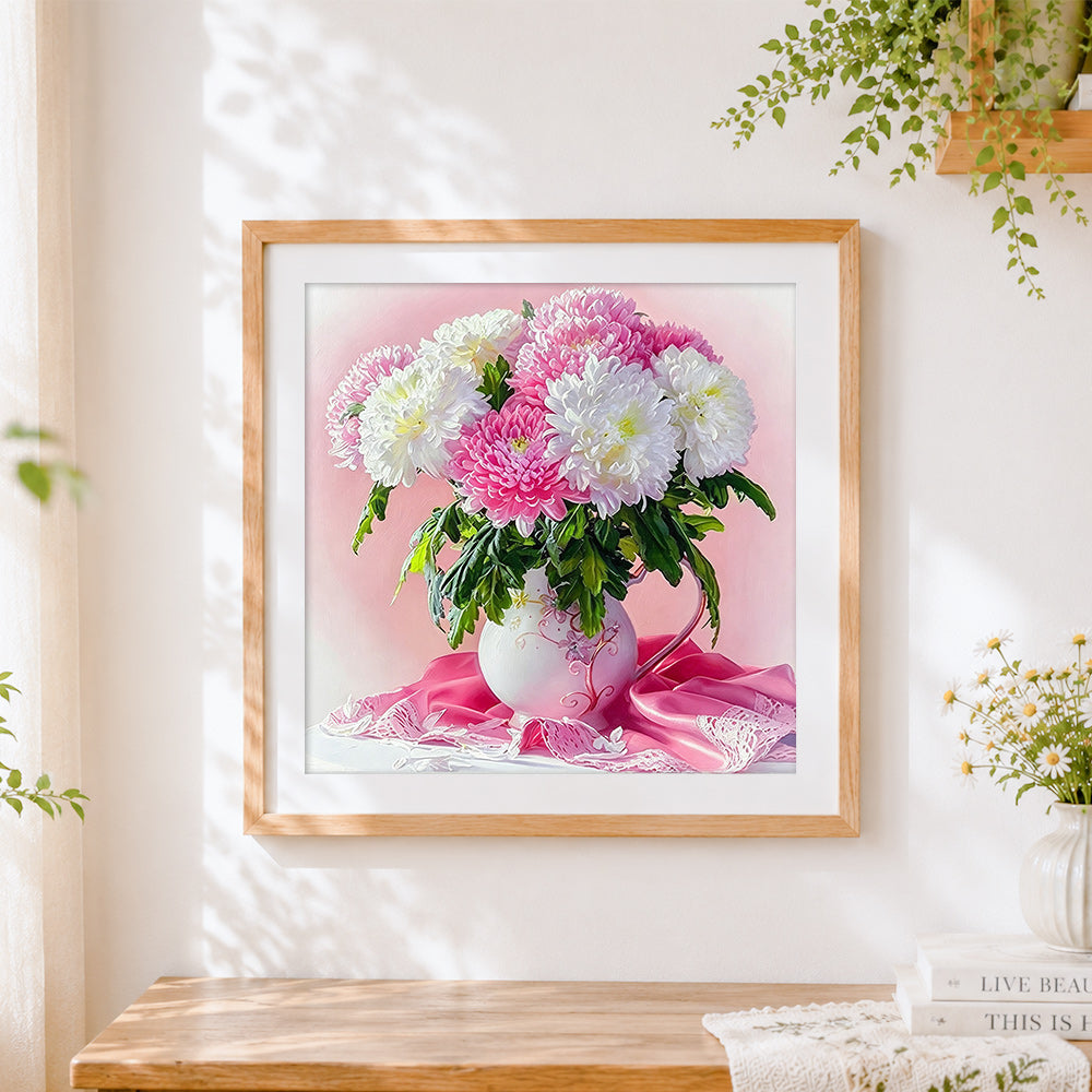 Finished pink and white chrysanthemums in a vase cross stitch artwork displayed