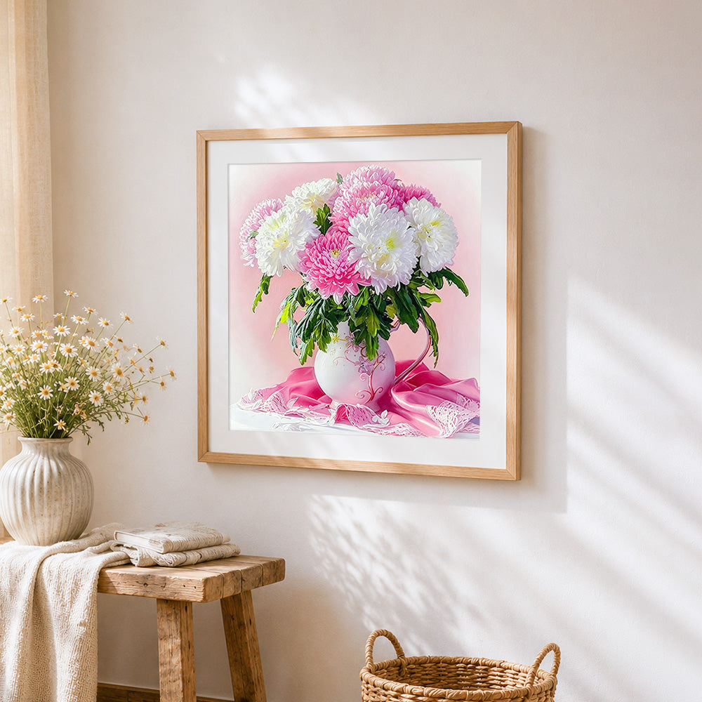 Pink and white chrysanthemums in a vase cross stitch artwork displayed on wall as home decor